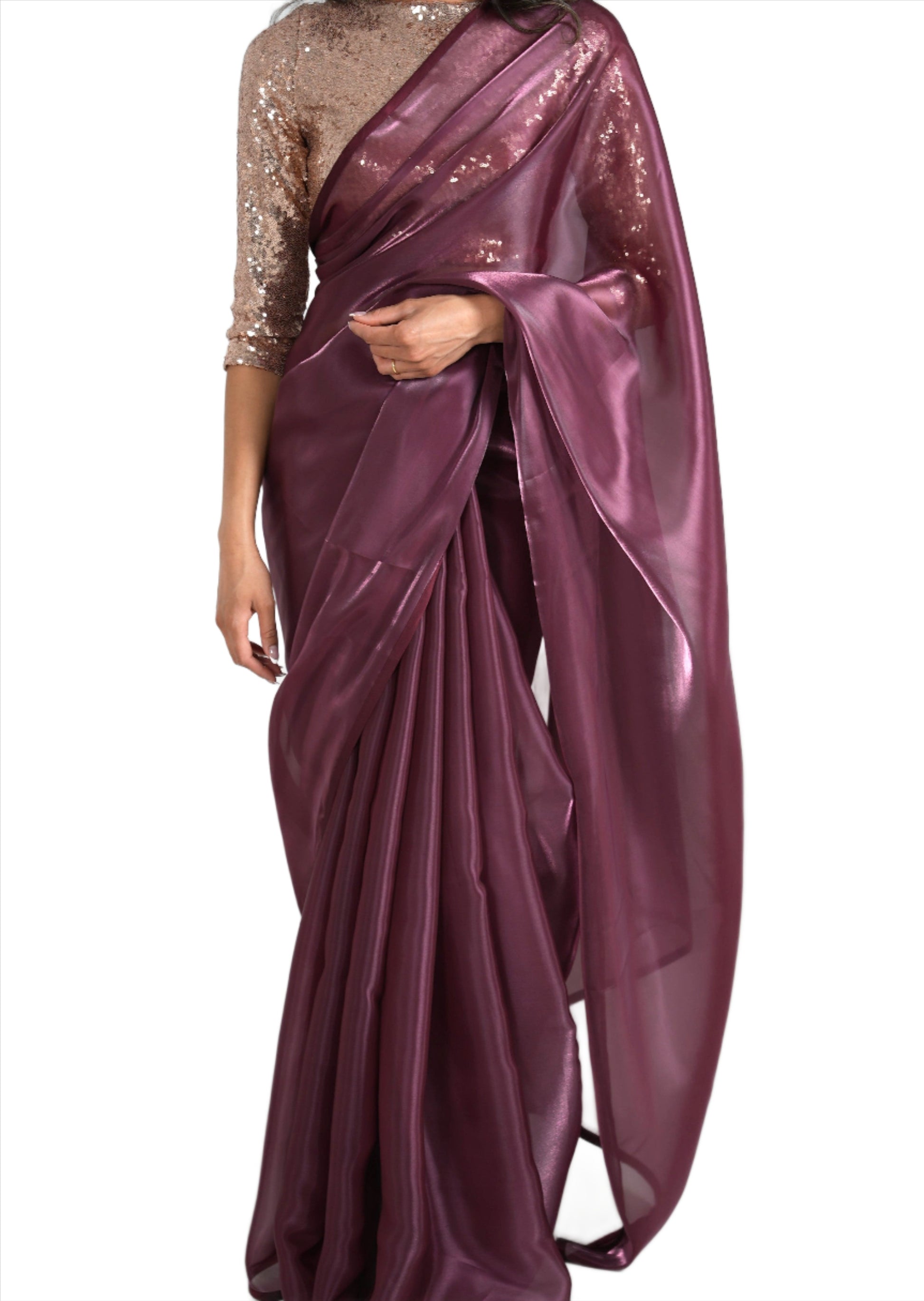 Model draped in a maroon/burgundy organza saree with maroon/burgundy satin border. Model is also wearing a rose gold 3/4 sleeve sequin crop top.